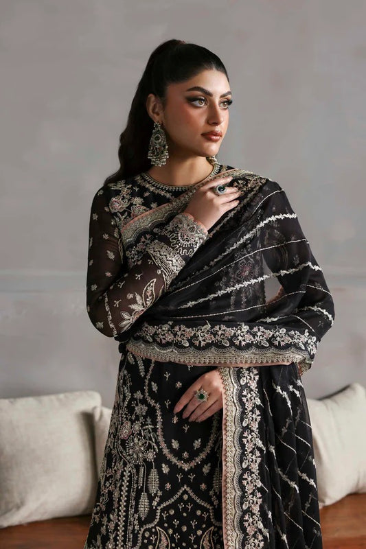 Elegant chiffon dress with embroidered front, back, and sleeves, paired with an organza dupatta and raw silk trouser — perfect for formal elegance.