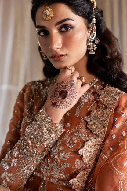 Exquisite organza suit with hand-embellished blouse, panels, sleeves, dupatta & raw silk trouser—crafted for a refined, elegant, and timeless look.