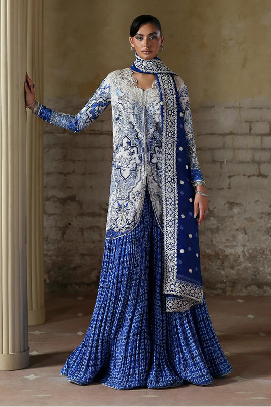 Elegant white blue printed silk suit with hand-embellished panels, embroidered dupatta,&   crushed sharara. Perfect for weddings, festive, and formal occasions.
