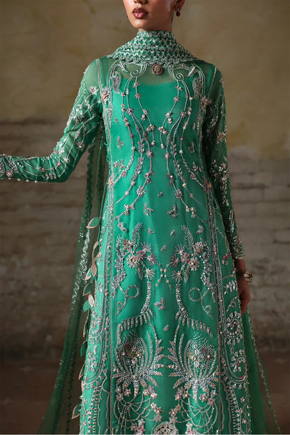 Shop this elegant Mazari Green unstitched suit with embroidered organza panels, hand embellishments, 3D floral details, silk trouser & net dupatta.