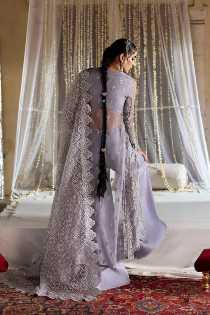 Elegant organza outfit with hand-embellished blouse, panels, sleeves, dupatta & raw silk trouser—crafted for timeless beauty and refined style.