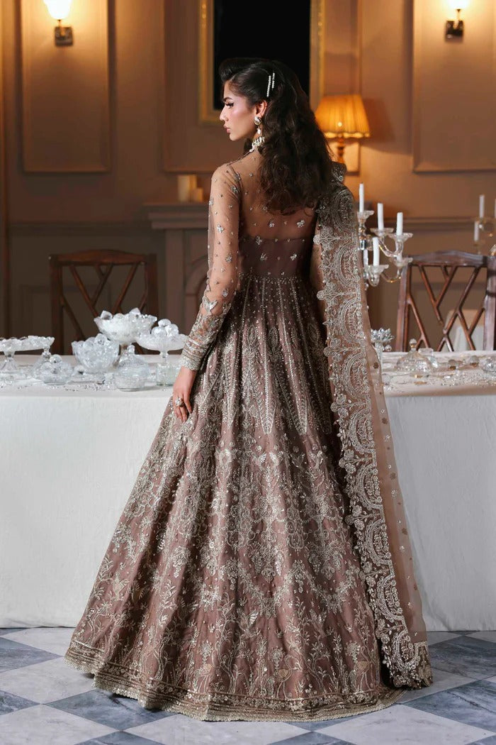 Stylish net suit with embroidered panels, body, blouse, sleeves & organza dupatta with borders, paired with silk inner—crafted for timeless elegance.