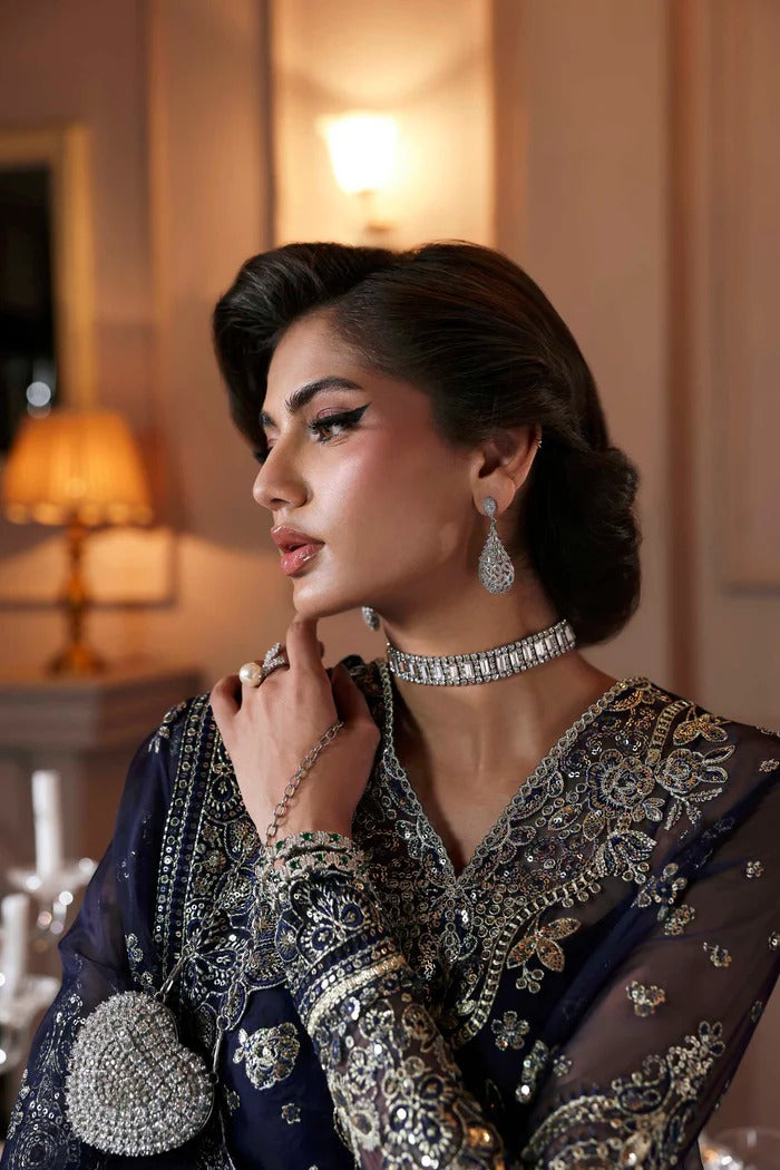 Elegant organza sharara outfit with embroidered front, back, sleeves & panels, paired with silk inner—crafted for a graceful and timeless look.