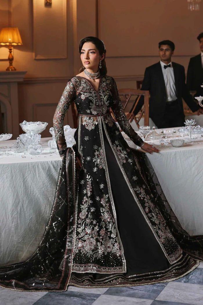 Stunning organza lehenga with embroidered panels, blouse, sleeves, dupatta & borders, paired with raw silk inner—crafted for regal elegance & style.