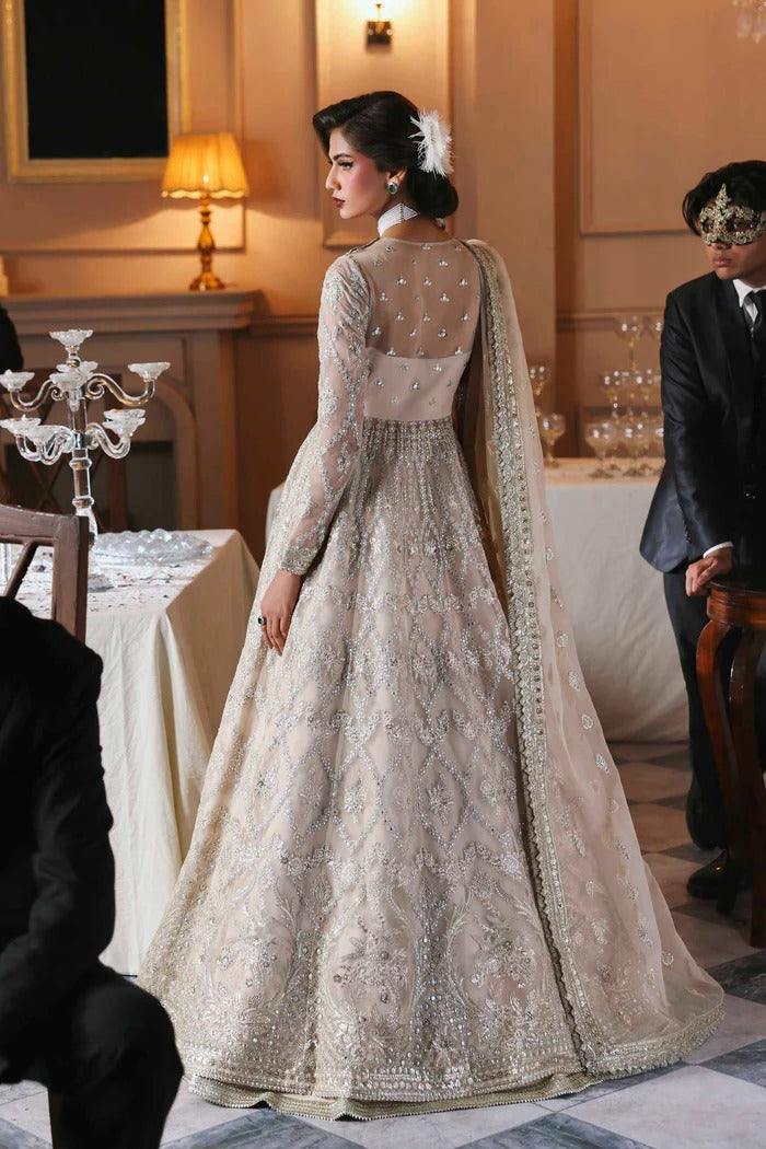 Chic organza dress featuring embroidered panels, blouse, sleeves & dupatta, paired with raw silk inner—crafted for timeless elegance and style.