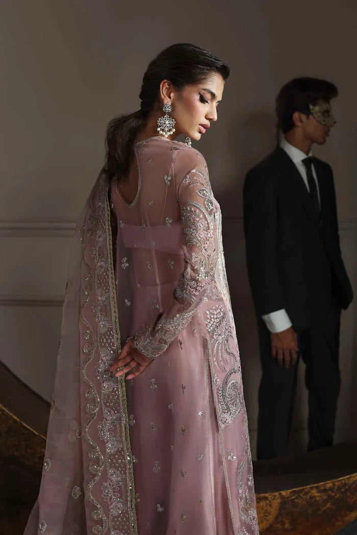 Elegant organza dress with embroidered panels, back, sleeves & dupatta, paired with silk inner and trouser—crafted for timeless charm and style.