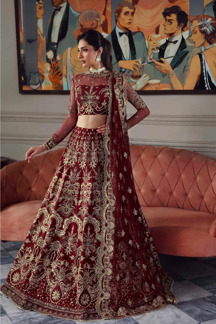 Elegant net dress featuring embroidered panels, blouse, neckline, sleeves & dupatta with borders, paired with silk inner—crafted for timeless grace.