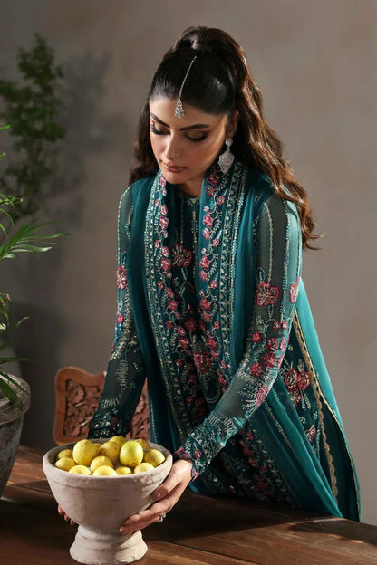 Elegant chiffon outfit featuring embroidered front, back, and sleeves with organza borders. Paired with a chiffon dupatta and raw silk trouser for a refined look.