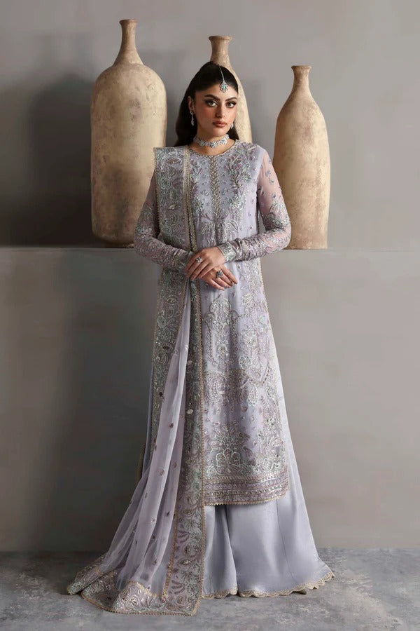 Graceful chiffon outfit with embroidered front, back, and sleeves enhanced by organza borders. Paired with a chiffon dupatta and raw silk trouser for elegance.