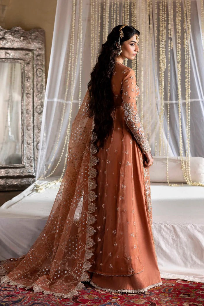 Exquisite organza suit with hand-embellished blouse, panels, sleeves, dupatta & raw silk trouser—crafted for a refined, elegant, and timeless look.