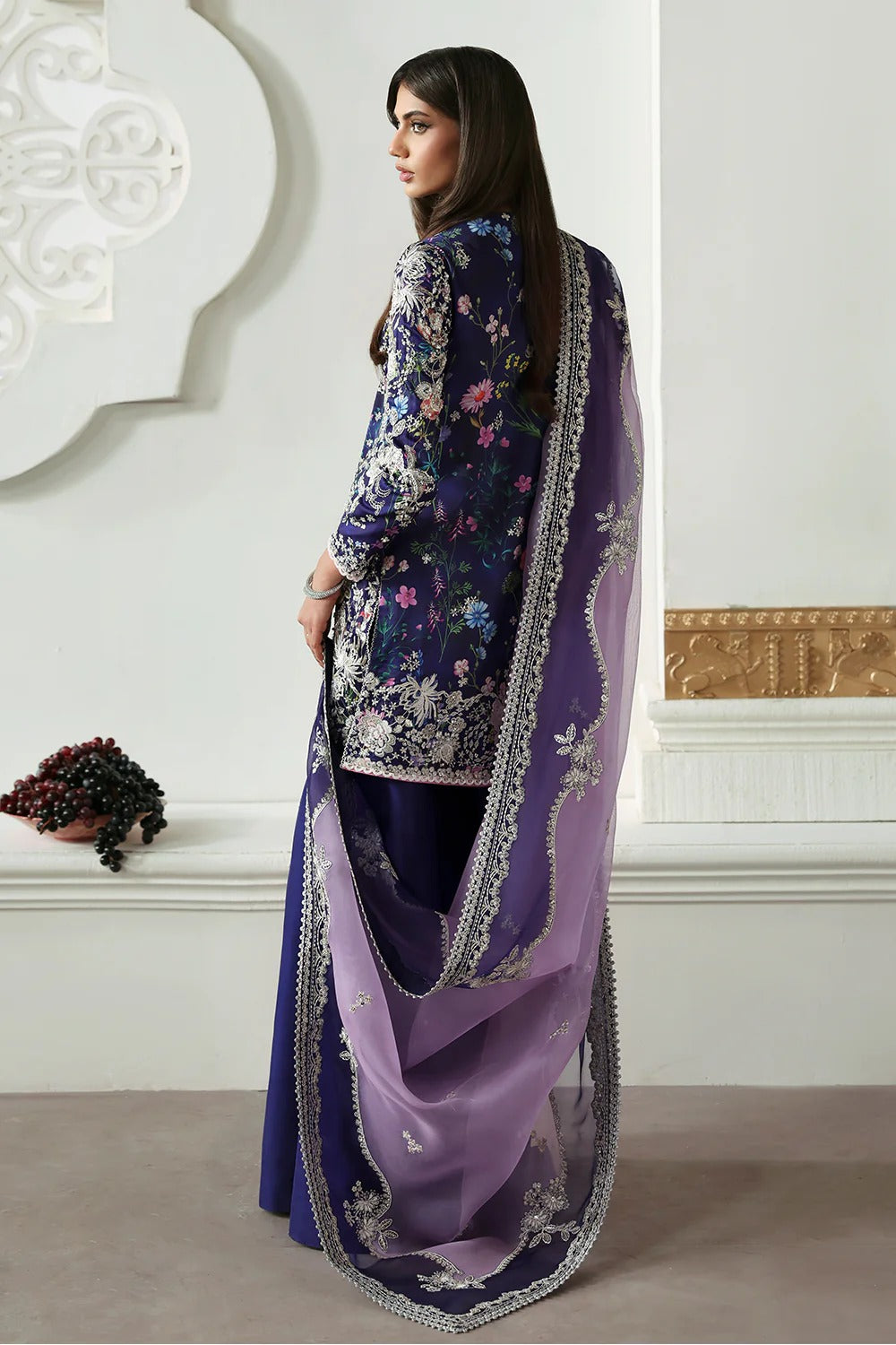 Elegant floral printed purple silk suit with embroidered panels, embellished organza dupatta, and matching silk trousers. A perfect outfit for festive & formal occasions.