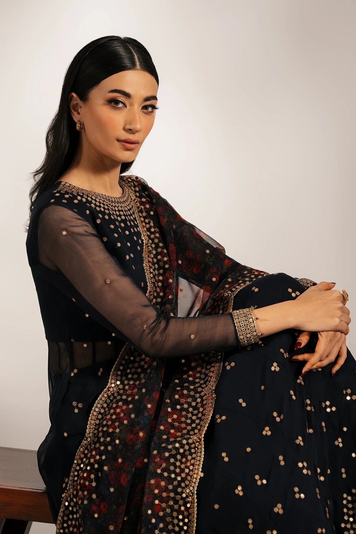 Intricately embroidered chiffon with digital print dupatta & rawsilk bottom—perfect for formal occasions. A luxurious look in every detail. Shop UC-3073 now!