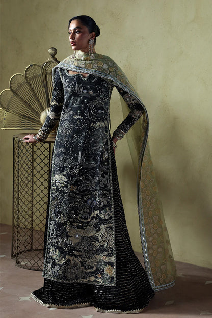 Stylish black silk suit featuring hand-embellished panels, embroidered dupatta, and chiffon crushed trousers. Perfect choice for festive and formal occasions.