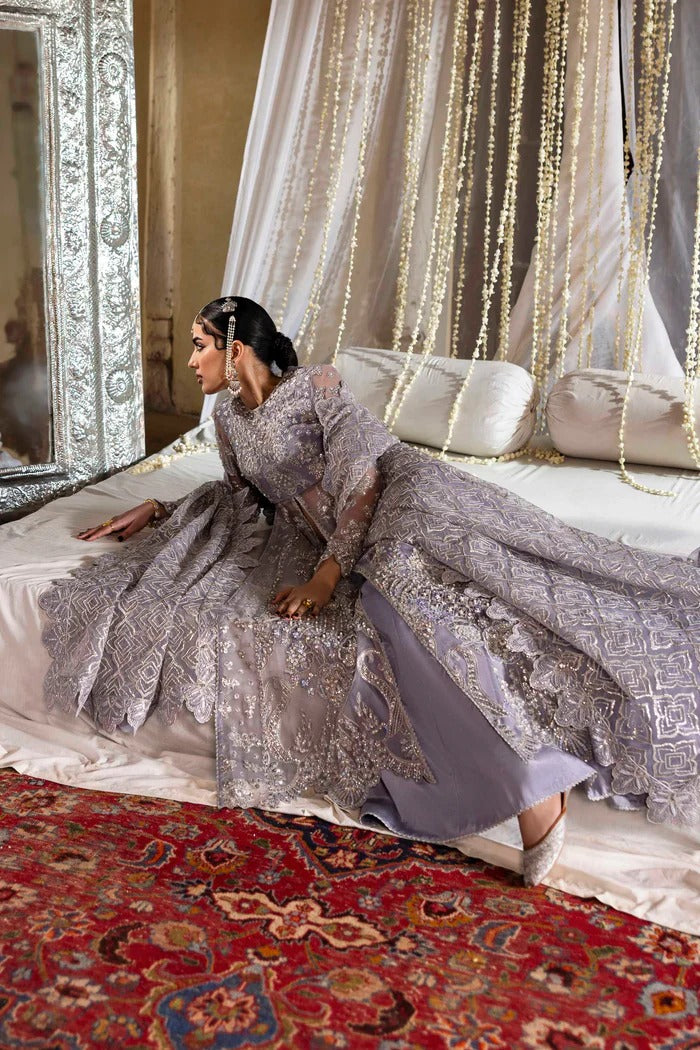 Elegant organza outfit with hand-embellished blouse, panels, sleeves, dupatta & raw silk trouser—crafted for timeless beauty and refined style.