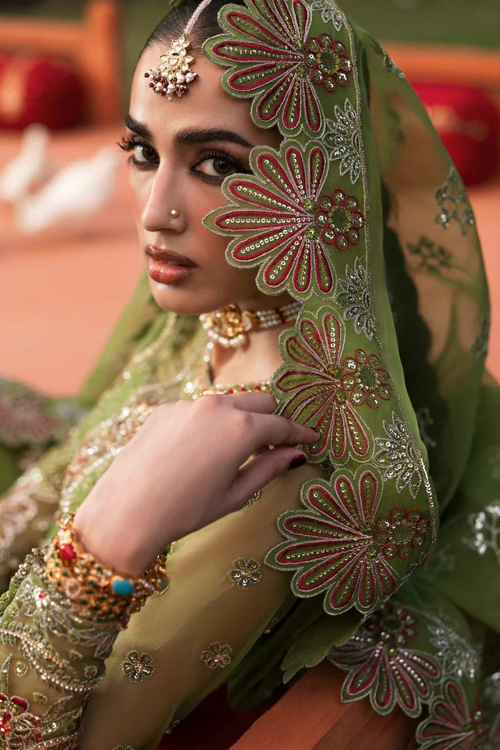 Premium organza suit with hand-embellished front, borders, dupatta, sleeves & raw silk trouser—crafted for elegance, style, and timeless charm.