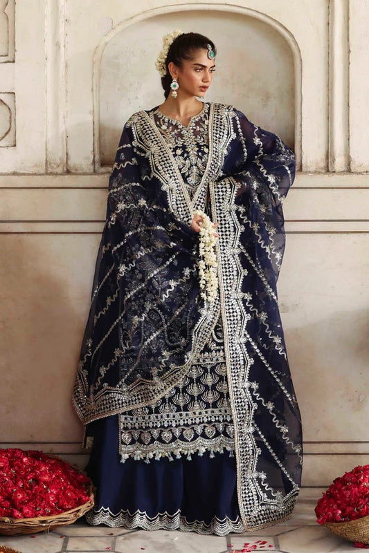 A luxurious organza outfit featuring hand-embellished front, sleeves, and borders. Comes with an embroidered dupatta and raw silk trouser for a graceful formal look.