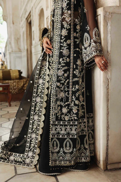 Elegant organza outfit with hand-embellished panels, sleeves, and borders, paired with a matching dupatta and raw silk trouser for a refined formal look.