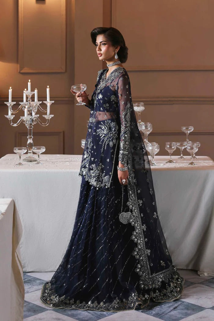 Elegant organza sharara outfit with embroidered front, back, sleeves & panels, paired with silk inner—crafted for a graceful and timeless look.