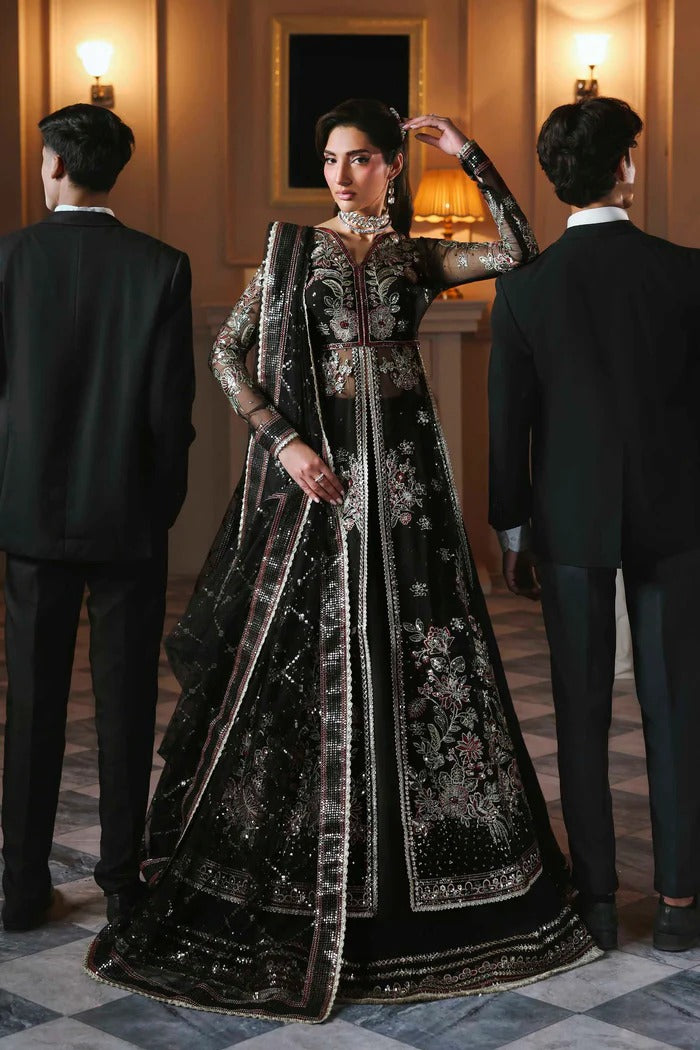 Stunning organza lehenga with embroidered panels, blouse, sleeves, dupatta & borders, paired with raw silk inner—crafted for regal elegance & style.