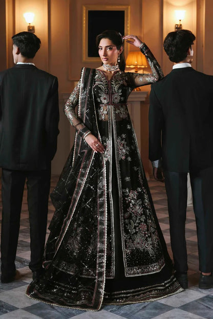 Stunning organza lehenga with embroidered panels, blouse, sleeves, dupatta & borders, paired with raw silk inner—crafted for regal elegance & style.