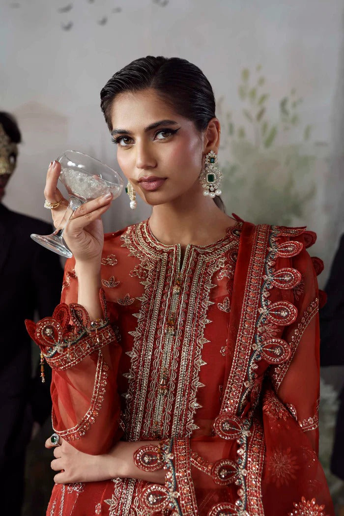 Stylish organza suit with embroidered front, neckline, back, sleeves & dupatta, paired with silk inner and trouser—crafted for elegance and grace.