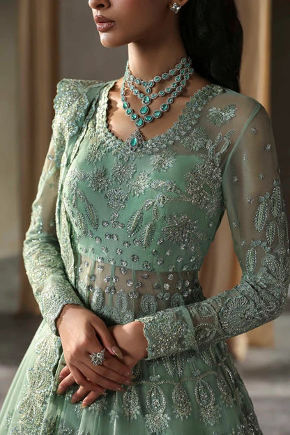 Elegant chiffon outfit featuring embroidered panels, sleeves, and dupatta with organza borders, paired with a luxurious raw silk inner for timeless grace.