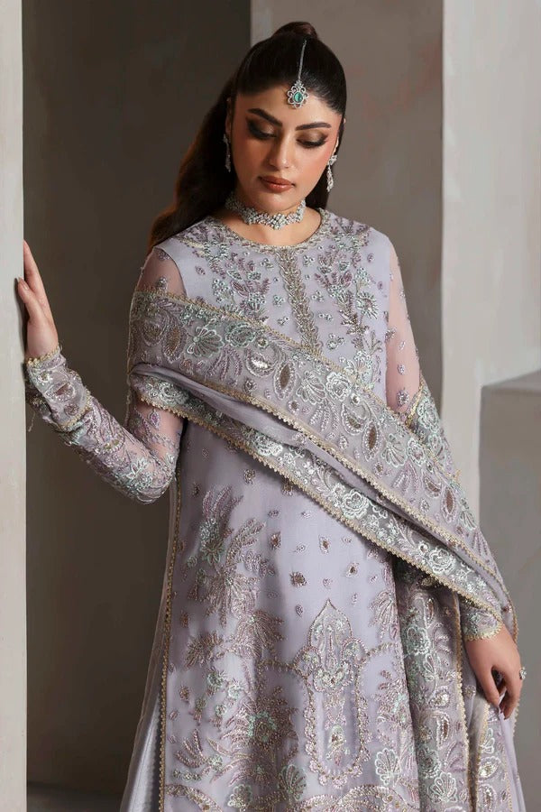Graceful chiffon outfit with embroidered front, back, and sleeves enhanced by organza borders. Paired with a chiffon dupatta and raw silk trouser for elegance.