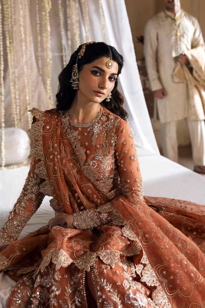 Exquisite organza suit with hand-embellished blouse, panels, sleeves, dupatta & raw silk trouser—crafted for a refined, elegant, and timeless look.