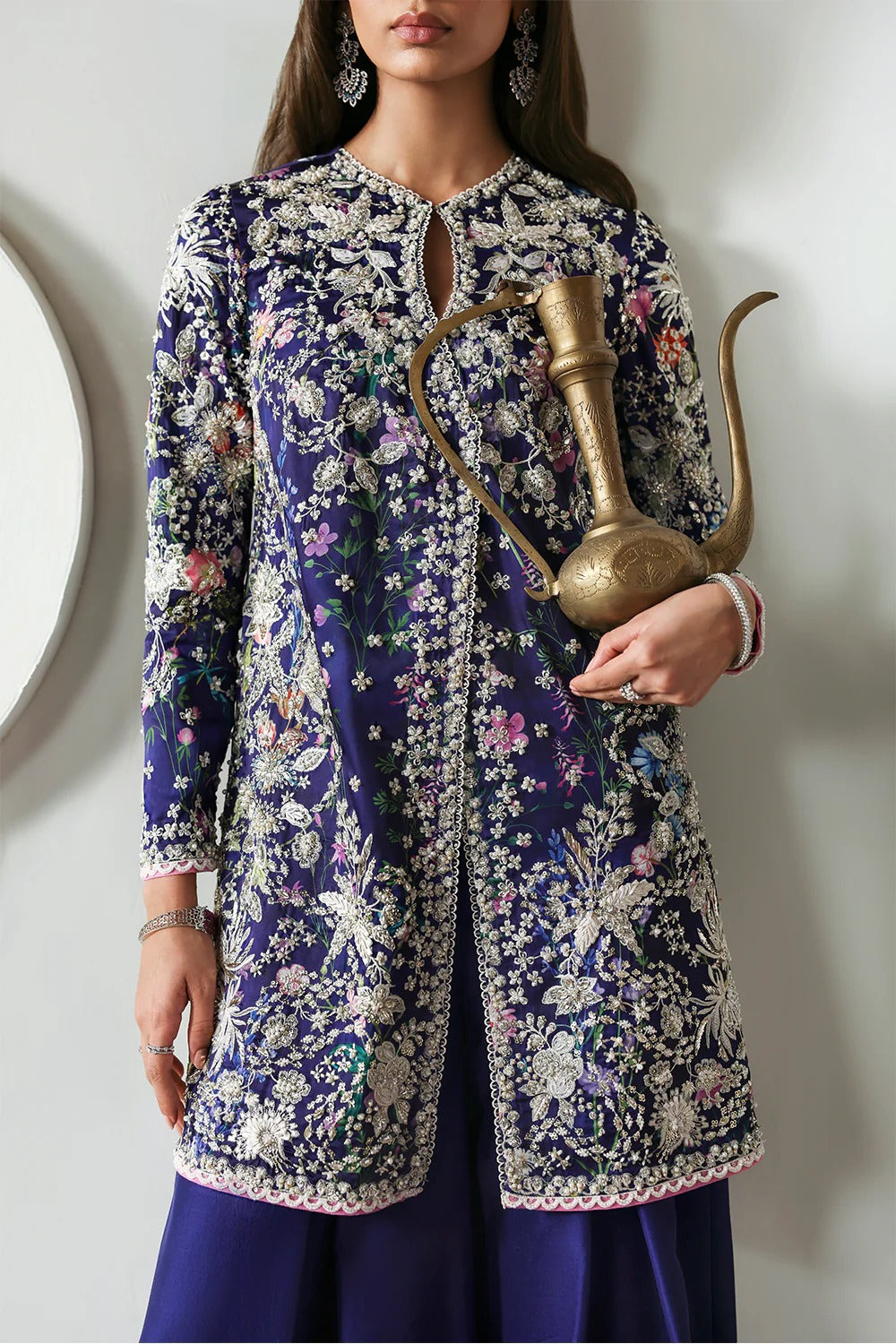 Elegant floral printed purple silk suit with embroidered panels, embellished organza dupatta, and matching silk trousers. A perfect outfit for festive & formal occasions.