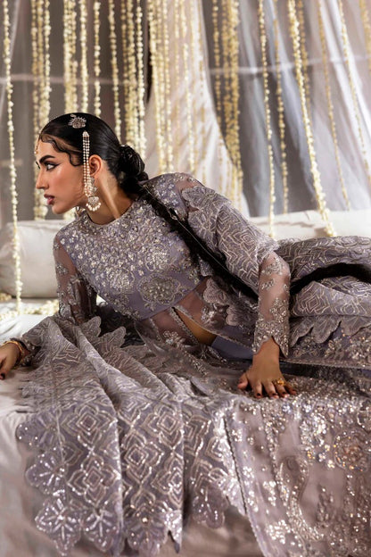 Elegant organza outfit with hand-embellished blouse, panels, sleeves, dupatta & raw silk trouser—crafted for timeless beauty and refined style.