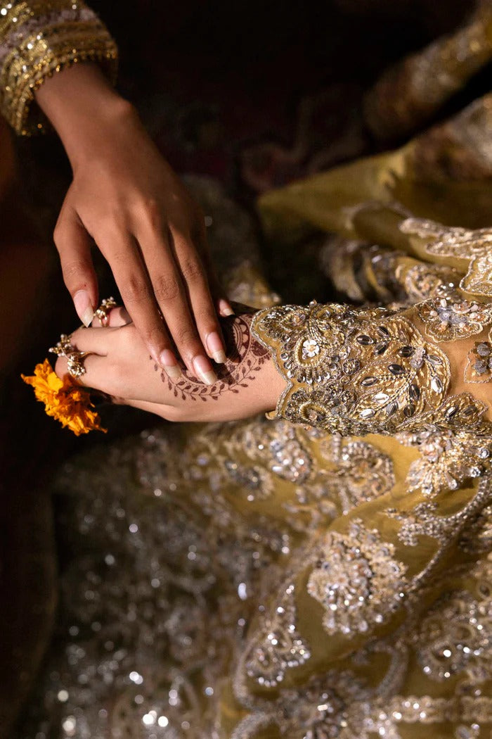 Stunning organza lehenga with embellished panels, blouse, sleeves, dupatta & borders, paired with raw silk inner—crafted for elegance and luxury.