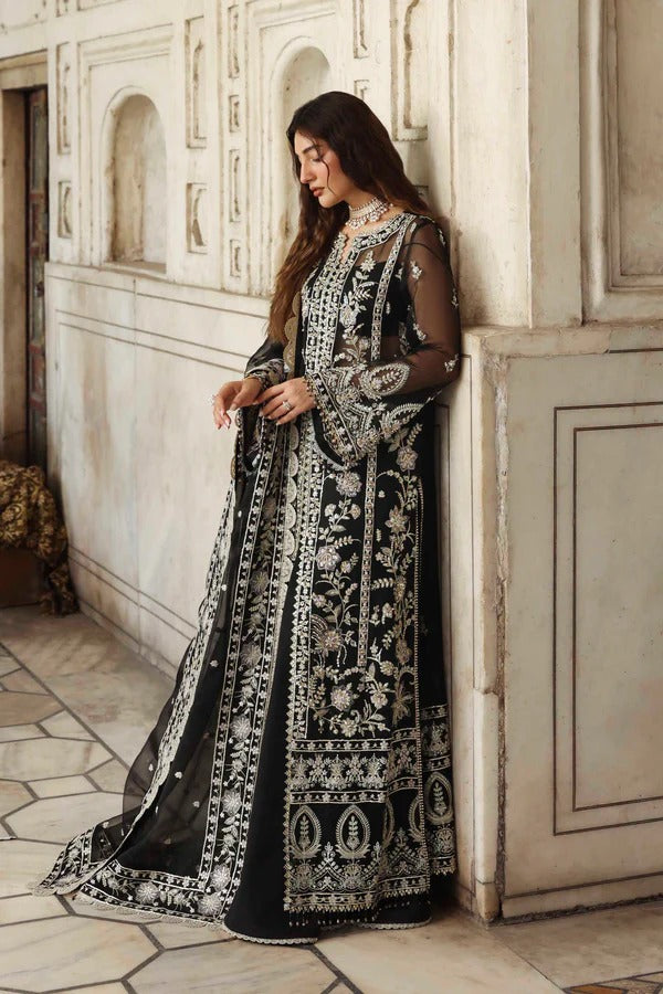 Elegant organza outfit with hand-embellished panels, sleeves, and borders, paired with a matching dupatta and raw silk trouser for a refined formal look.