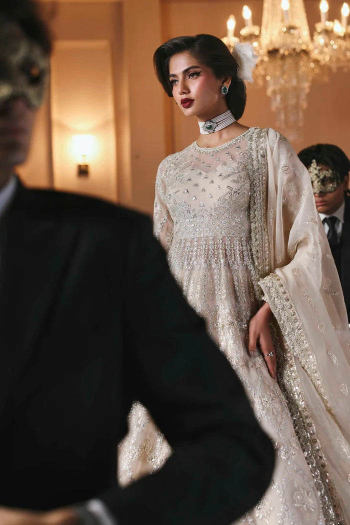 Chic organza dress featuring embroidered panels, blouse, sleeves & dupatta, paired with raw silk inner—crafted for timeless elegance and style.