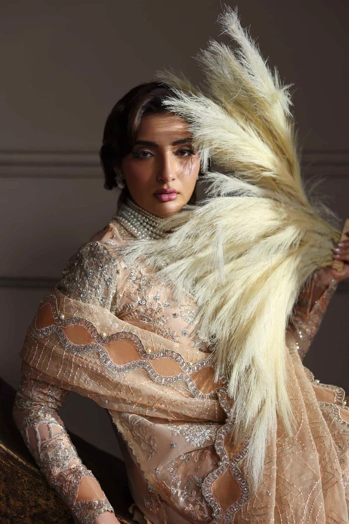 Elegant organza suit featuring embroidered front, back, sleeves, dupatta & trouser with borders, paired with silk inner—crafted for timeless grace.