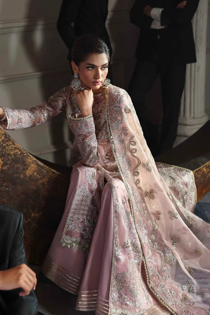 Elegant organza dress with embroidered panels, back, sleeves & dupatta, paired with silk inner and trouser—crafted for timeless charm and style.