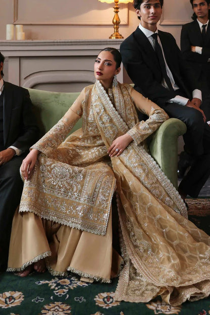 Elegant organza dress featuring embroidered panels, borders, sleeves & dupatta, paired with silk inner and trouser—crafted for timeless luxury style.