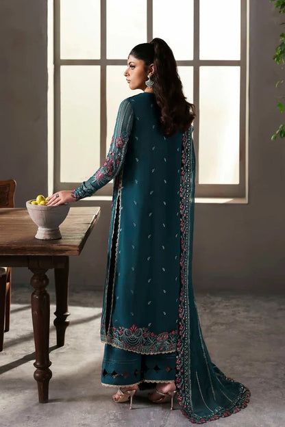 Elegant chiffon outfit featuring embroidered front, back, and sleeves with organza borders. Paired with a chiffon dupatta and raw silk trouser for a refined look.