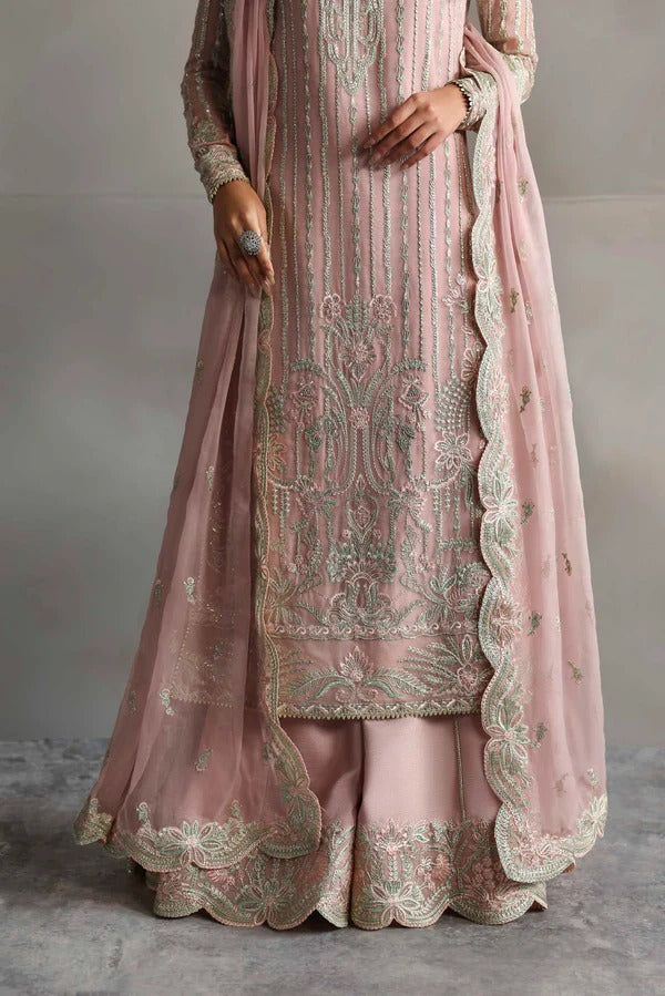 Beautiful chiffon dress with embroidered front, back, and sleeves, paired with organza borders, chiffon dupatta, and raw silk trouser for a refined look.