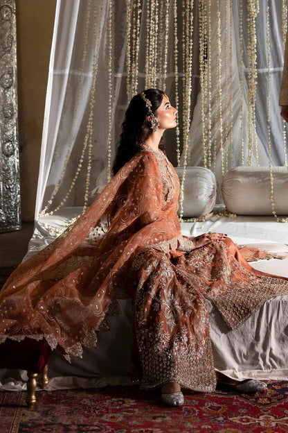 Exquisite organza suit with hand-embellished blouse, panels, sleeves, dupatta & raw silk trouser—crafted for a refined, elegant, and timeless look.