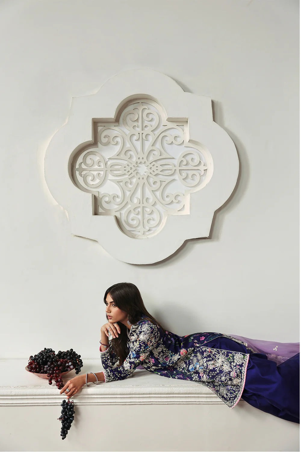 Elegant floral printed purple silk suit with embroidered panels, embellished organza dupatta, and matching silk trousers. A perfect outfit for festive & formal occasions.