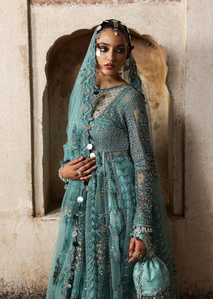 Dreamy ice blue net pishwas with sequin embroidery, silk lehnga, and chiffon dupatta. Unstitched luxury outfit that radiates elegance and grace.