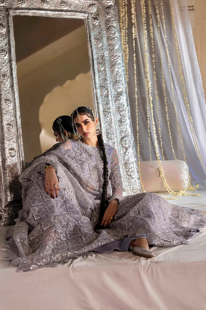 Elegant organza outfit with hand-embellished blouse, panels, sleeves, dupatta & raw silk trouser—crafted for timeless beauty and refined style.