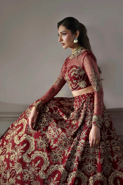 Elegant net dress featuring embroidered panels, blouse, neckline, sleeves & dupatta with borders, paired with silk inner—crafted for timeless grace.