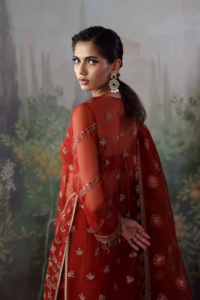 Stylish organza suit with embroidered front, neckline, back, sleeves & dupatta, paired with silk inner and trouser—crafted for elegance and grace.