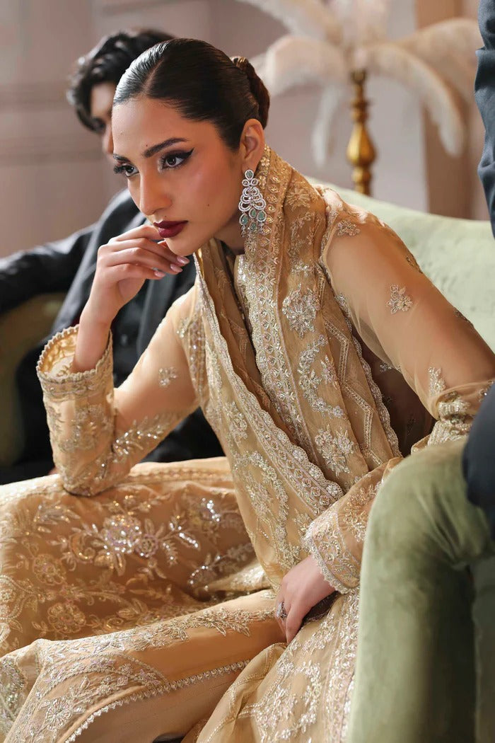 Elegant organza dress featuring embroidered panels, borders, sleeves & dupatta, paired with silk inner and trouser—crafted for timeless luxury style.
