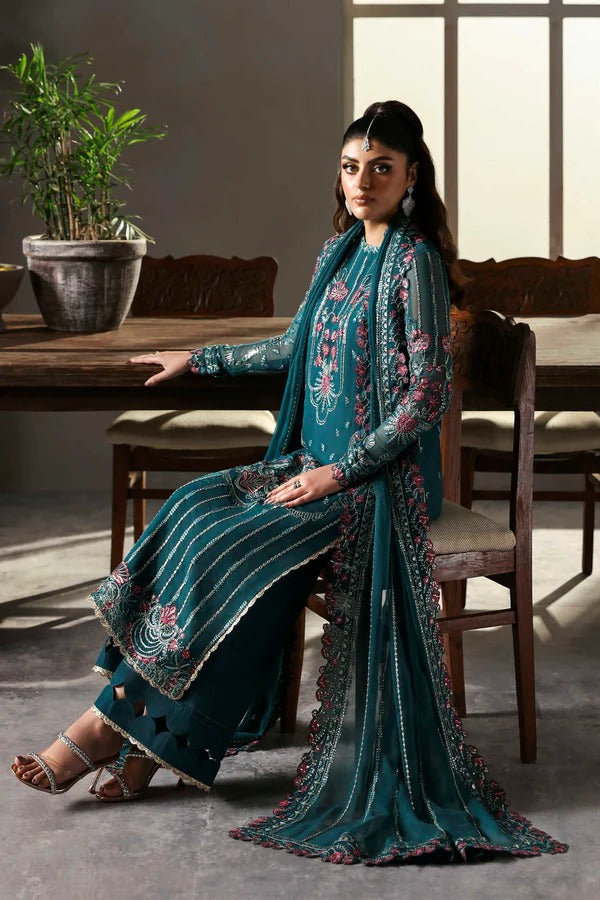 Elegant chiffon outfit featuring embroidered front, back, and sleeves with organza borders. Paired with a chiffon dupatta and raw silk trouser for a refined look.