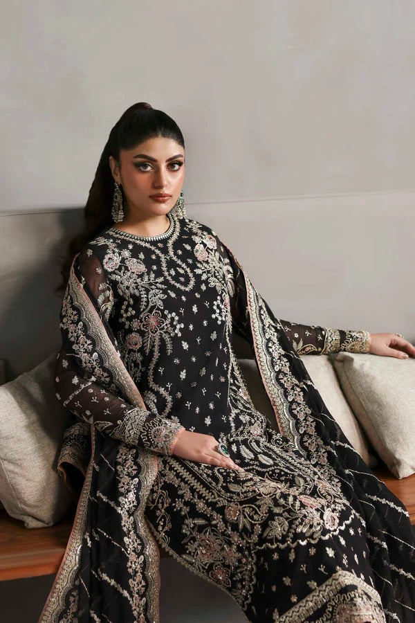 Elegant chiffon dress with embroidered front, back, and sleeves, paired with an organza dupatta and raw silk trouser — perfect for formal elegance.