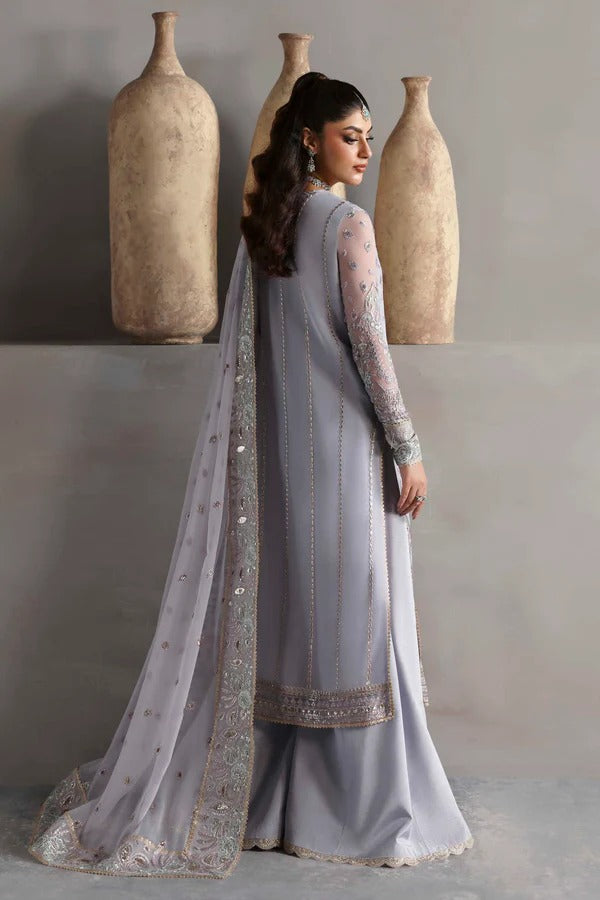 Graceful chiffon outfit with embroidered front, back, and sleeves enhanced by organza borders. Paired with a chiffon dupatta and raw silk trouser for elegance.