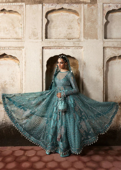 Dreamy ice blue net pishwas with sequin embroidery, silk lehnga, and chiffon dupatta. Unstitched luxury outfit that radiates elegance and grace.