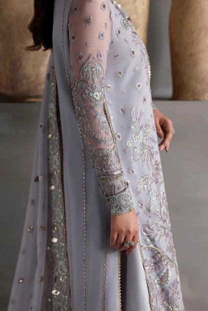 Graceful chiffon outfit with embroidered front, back, and sleeves enhanced by organza borders. Paired with a chiffon dupatta and raw silk trouser for elegance.